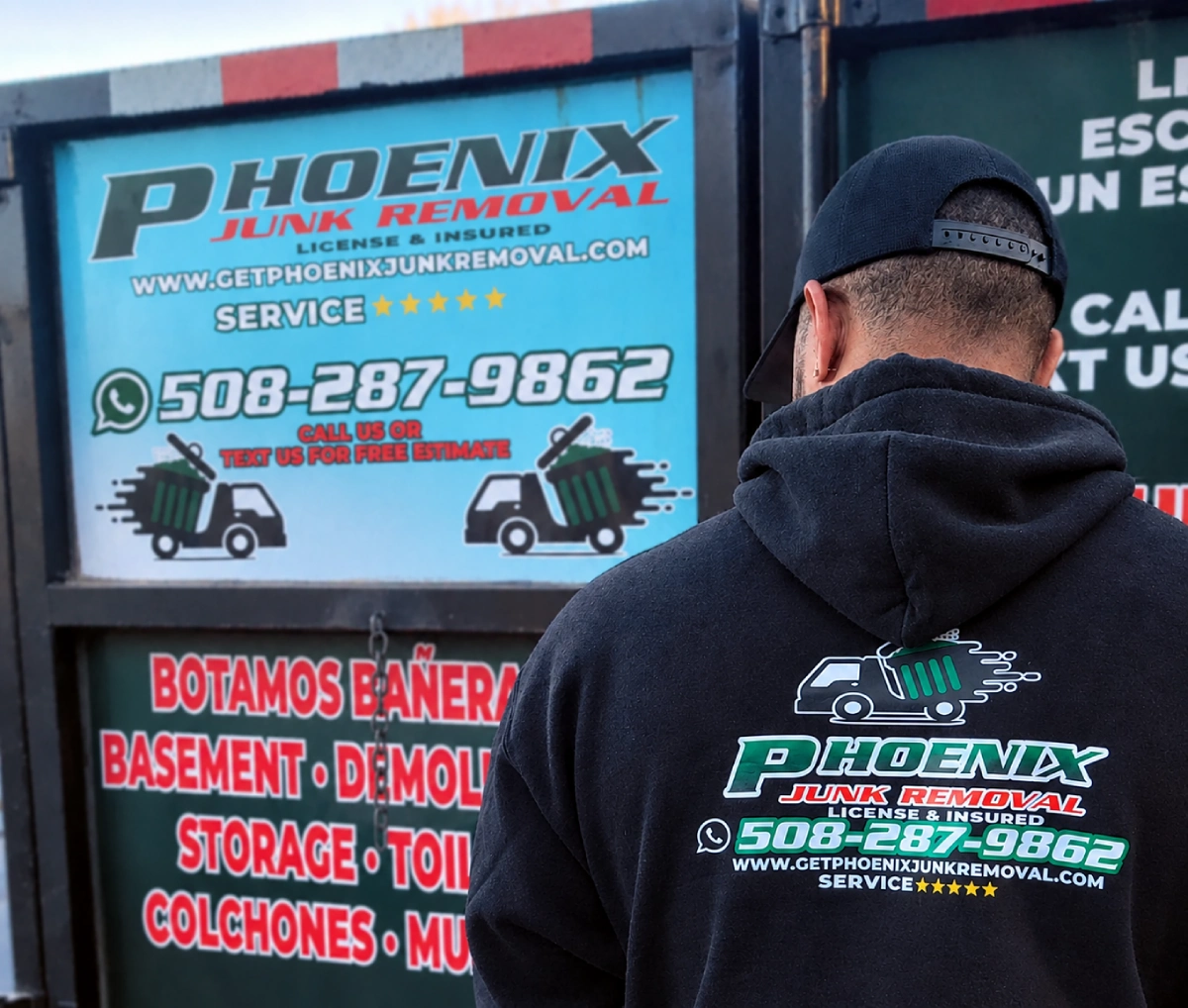 junk removal Rhode Island owner standing with a truck in Providence
