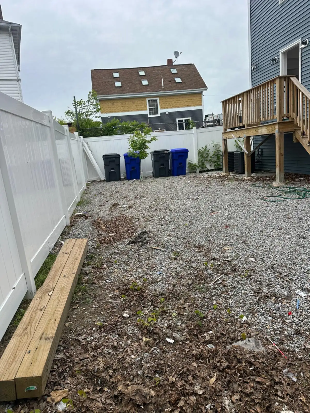 Gravel yard under the deck cleared after junk removal