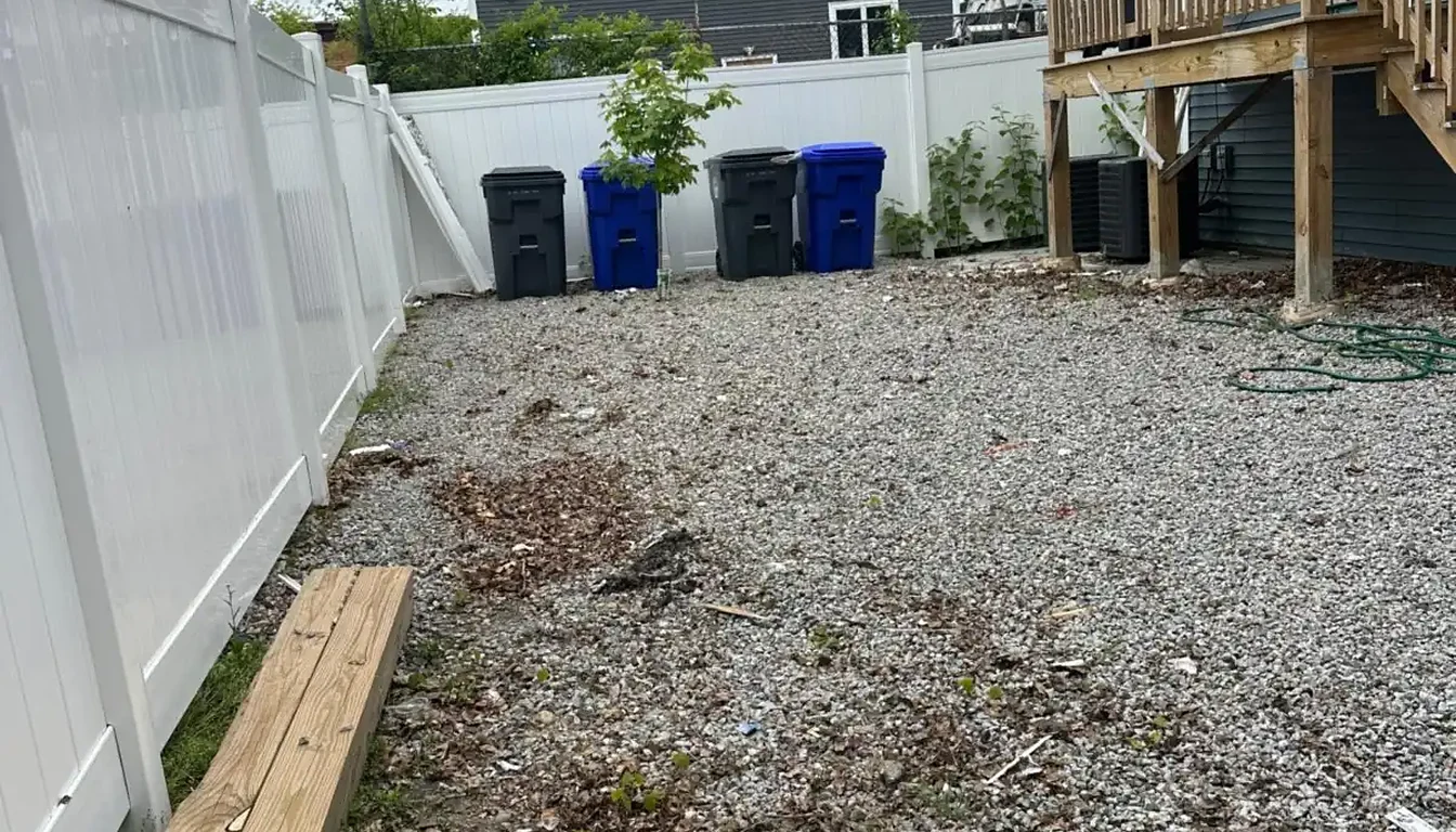 Gravel yard under the deck cleared after junk removal