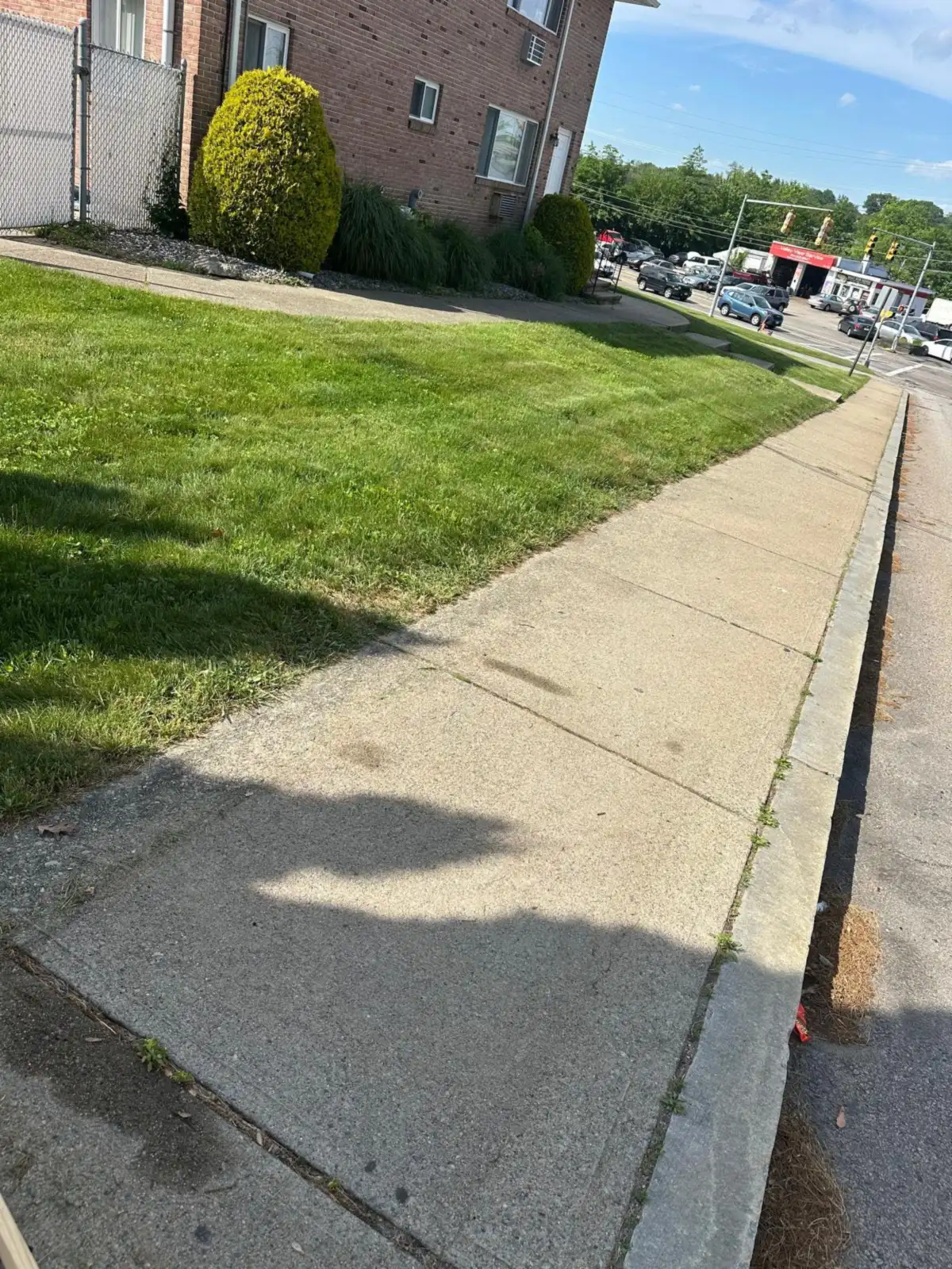 Sidewalk and lawn clear after curbside couch pickup