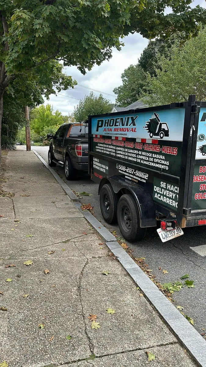 Phoenix Junk Removal Dump Trailer parked in Rhode Island