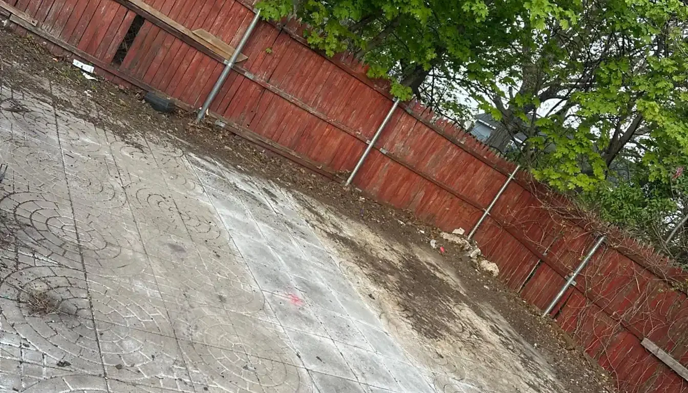 Paved yard swept clean after a trash cleanout