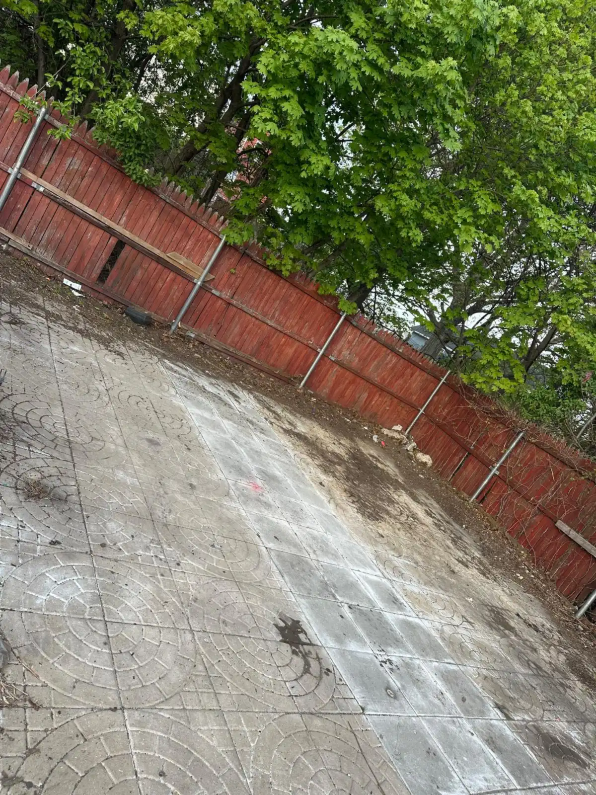 Junk removal before and after Rhode Island: paved yard swept clean after a trash cleanout