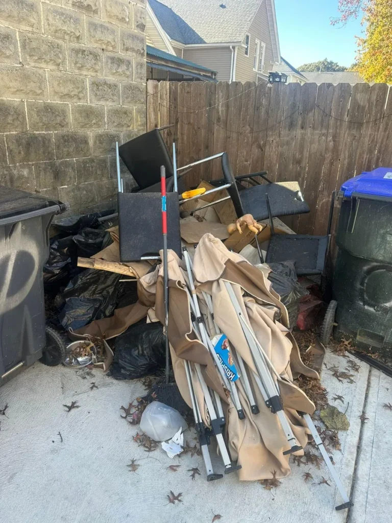 garage junk pile before removal