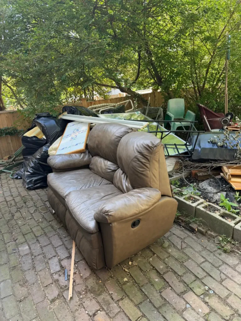 leather recliner and patio junk pile