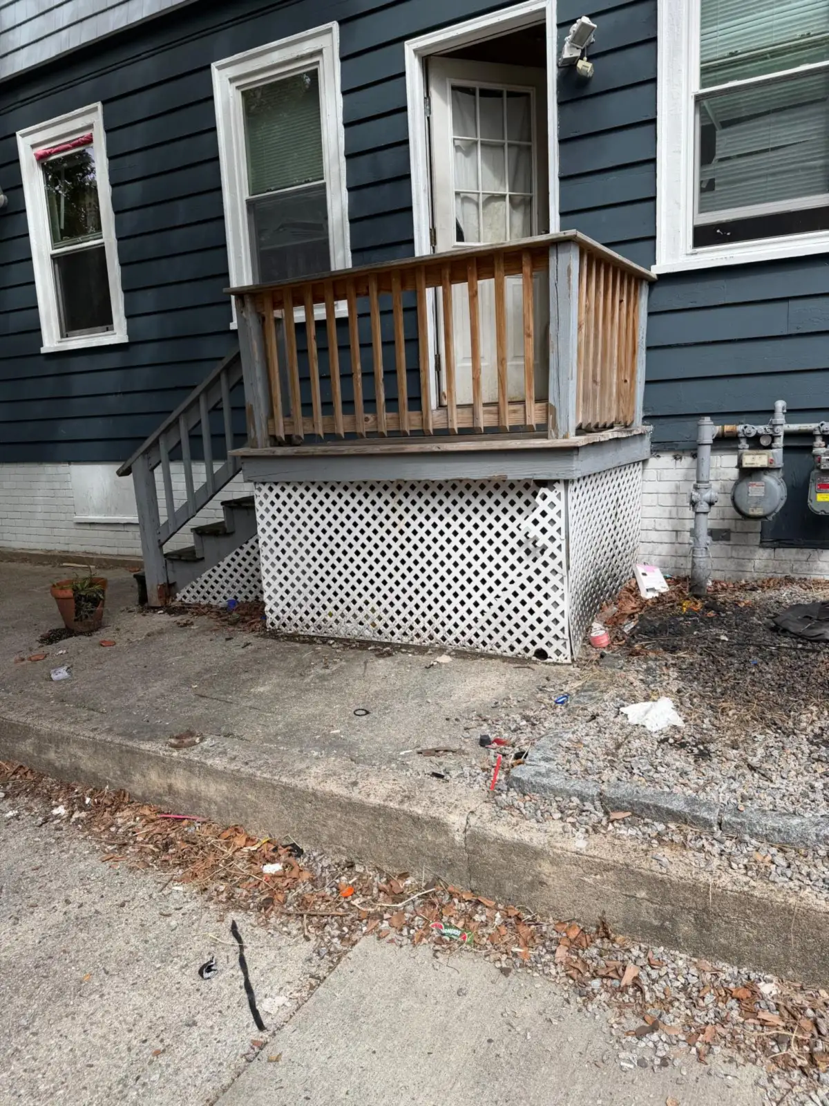 Back porch cleared after old doors and chair were removed