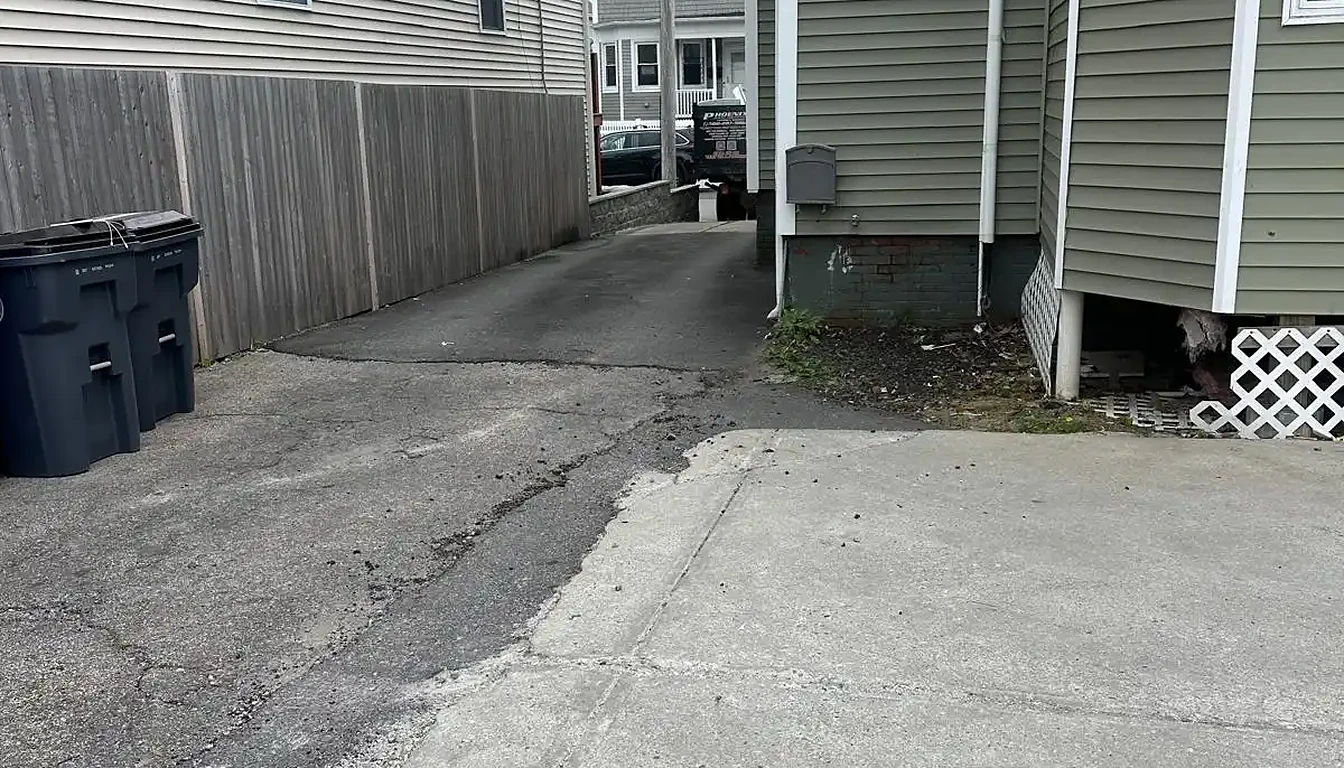 Driveway between two houses cleared after junk removal