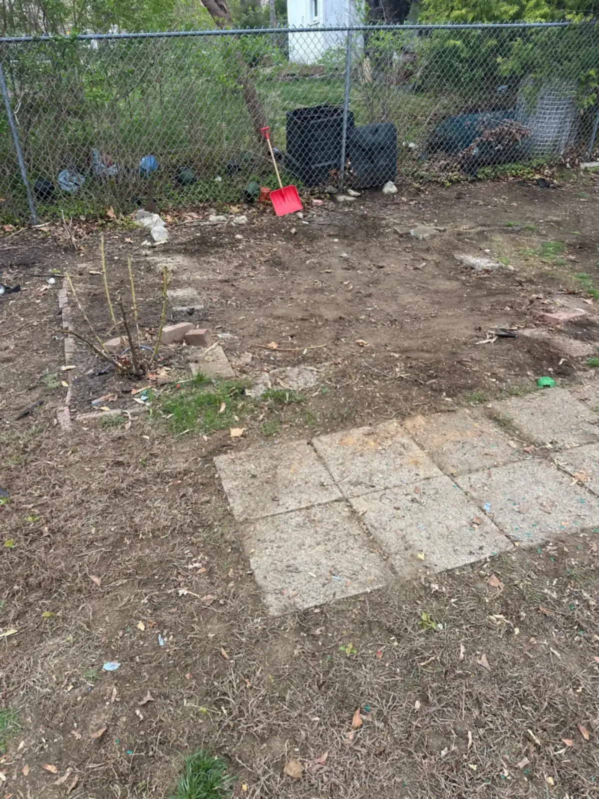 Bare ground and paving slabs left after shed removal in Rhode Island
